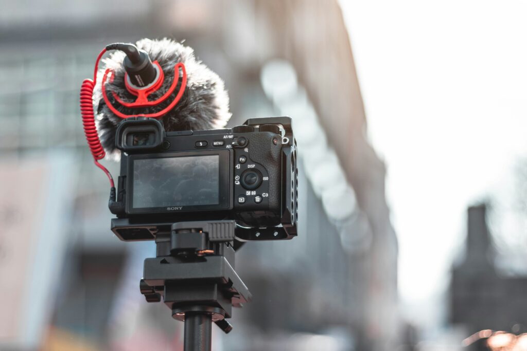 Sony camera with Rode shotgun microphone mounted on a tripod for vlogging
